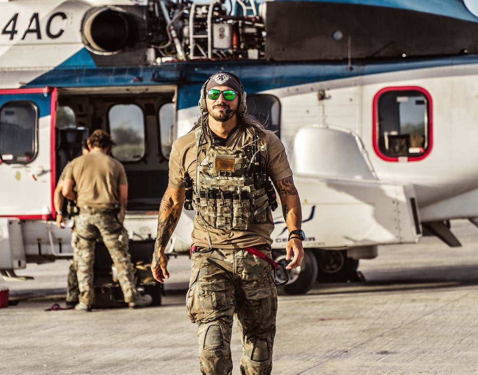 Tactical team members near a helicopter